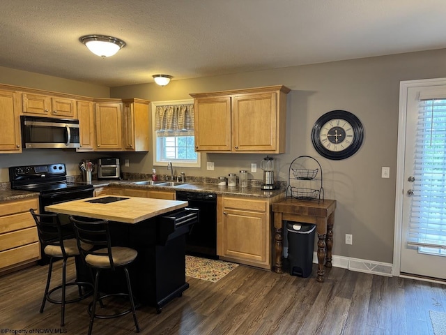203 Tarbert Ct, Morgantown, WV 26508 - kitchen with black appliances, a sink, butcher block counters, a kitchen breakfast bar, and dark wood-style floors