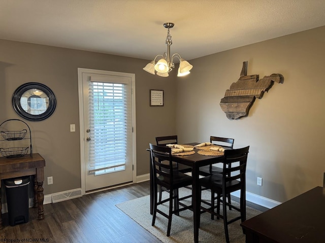 203 Tarbert Ct, Morgantown, WV 26508 - dining space with dark wood-type flooring, a chandelier, and baseboards