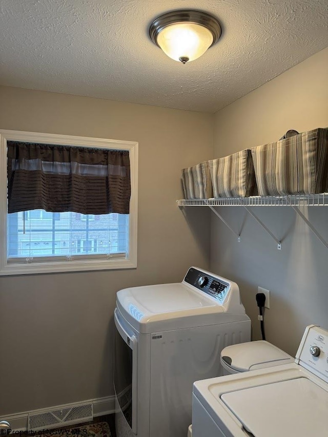 203 Tarbert Ct, Morgantown, WV 26508 - washroom with washer and dryer, a textured ceiling, and baseboards