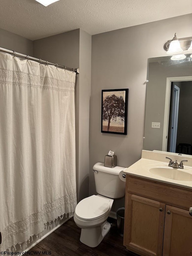 203 Tarbert Ct, Morgantown, WV 26508 - full bath featuring toilet, wood finished floors, vanity, a textured ceiling, and a shower with shower curtain