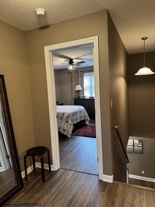 203 Tarbert Ct, Morgantown, WV 26508 - corridor with wood finished floors, an upstairs landing, baseboards, and a textured ceiling