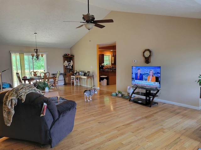 110 Woodmont Way, Fairmont, WV 26554 - living room with light wood-style floors, a ceiling fan, a chandelier, high vaulted ceiling, and baseboards
