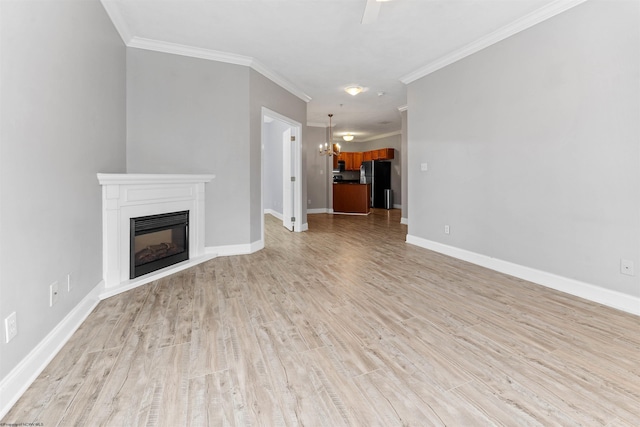 1318 Suncrest Vlg, Morgantown, WV 26505 - unfurnished living room featuring a glass covered fireplace, light wood-type flooring, crown molding, a chandelier, and baseboards