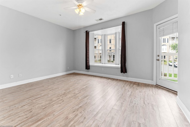 1318 Suncrest Vlg, Morgantown, WV 26505 - unfurnished room featuring light wood finished floors, plenty of natural light, ceiling fan, and baseboards