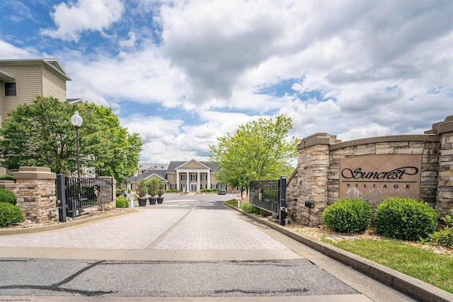 1318 Suncrest Vlg, Morgantown, WV 26505 - view of road with curbs, a gated entry, a gate, and street lights