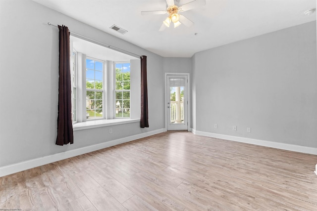 1318 Suncrest Vlg, Morgantown, WV 26505 - unfurnished room with light wood-style floors, a ceiling fan, and baseboards