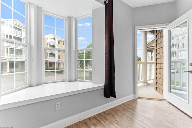 1318 Suncrest Vlg, Morgantown, WV 26505 - spare room featuring healthy amount of natural light, wood finished floors, and baseboards