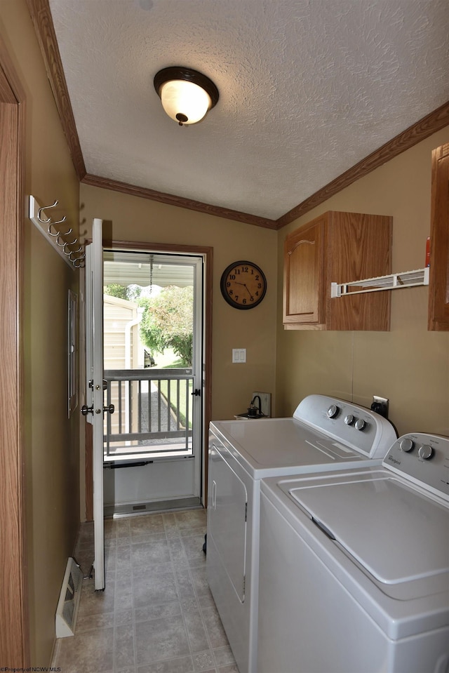 267 W Fork St, Clarksburg, WV 26301 - laundry area with cabinet space, washer and clothes dryer, a textured ceiling, crown molding, and baseboards