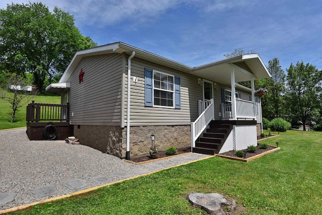 267 W Fork St, Clarksburg, WV 26301 - manufactured / mobile home with crawl space, a front lawn, and a porch
