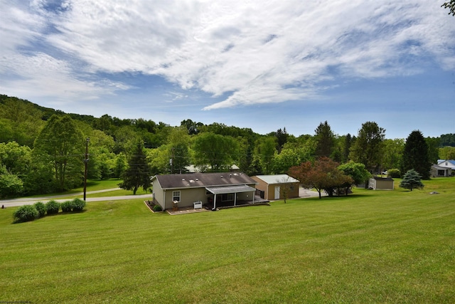 267 W Fork St, Clarksburg, WV 26301 - view of green lawn with a wooded view and an outbuilding