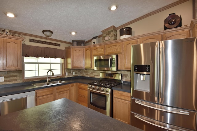 267 W Fork St, Clarksburg, WV 26301 - kitchen with stainless steel appliances, a sink, dark countertops, ornamental molding, and a textured ceiling