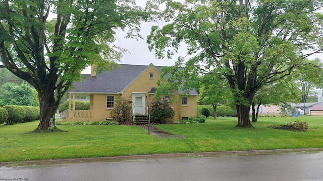 110 15th St, Elkins, WV 26241 - view of front facade with a front yard and brick siding