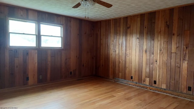 110 15th St, Elkins, WV 26241 - spare room with wooden walls, ceiling fan, and wood finished floors