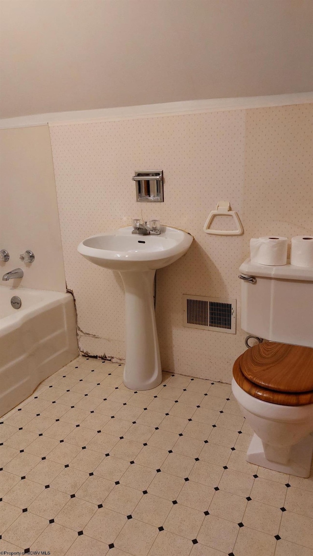 110 15th St, Elkins, WV 26241 - bathroom with tile patterned floors, toilet, a bath, and wallpapered walls