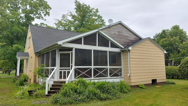110 15th St, Elkins, WV 26241 - rear view of house with a sunroom, a yard, and roof with shingles