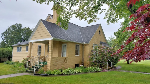 110 15th St, Elkins, WV 26241 - view of front of home featuring a front yard, brick siding, stairway, and a chimney