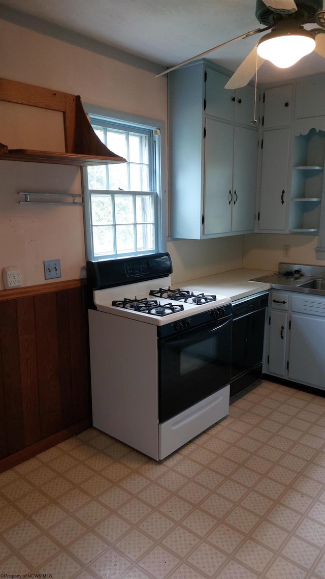 110 15th St, Elkins, WV 26241 - kitchen featuring range with gas stovetop, open shelves, white cabinets, ceiling fan, and light floors