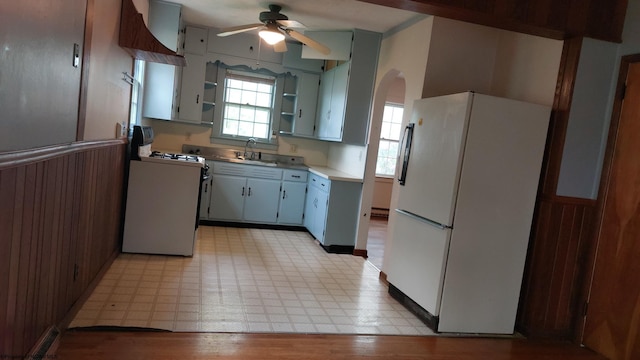 110 15th St, Elkins, WV 26241 - kitchen with white appliances, open shelves, ceiling fan, and light flooring
