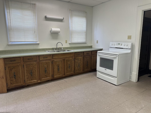 820 Field St, Fairmont, WV 26554 - kitchen with white electric range, a sink, and light countertops