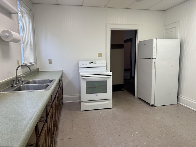 820 Field St, Fairmont, WV 26554 - kitchen featuring white appliances, a sink, baseboards, and light countertops