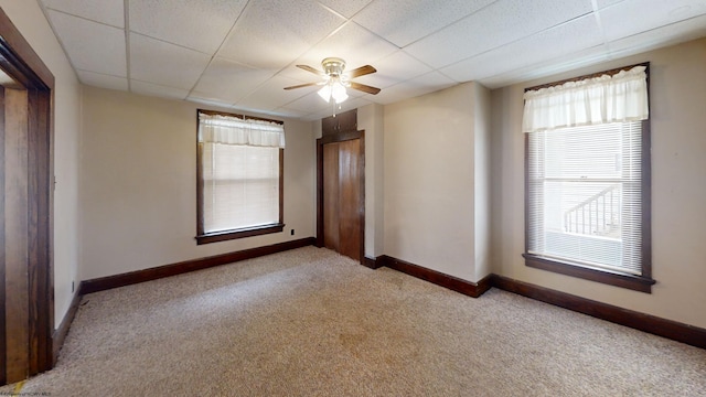 820 Field St, Fairmont, WV 26554 - empty room with carpet floors, a ceiling fan, baseboards, and a paneled ceiling