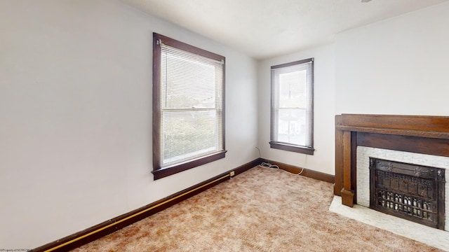 820 Field St, Fairmont, WV 26554 - unfurnished living room featuring carpet, baseboards, and a fireplace