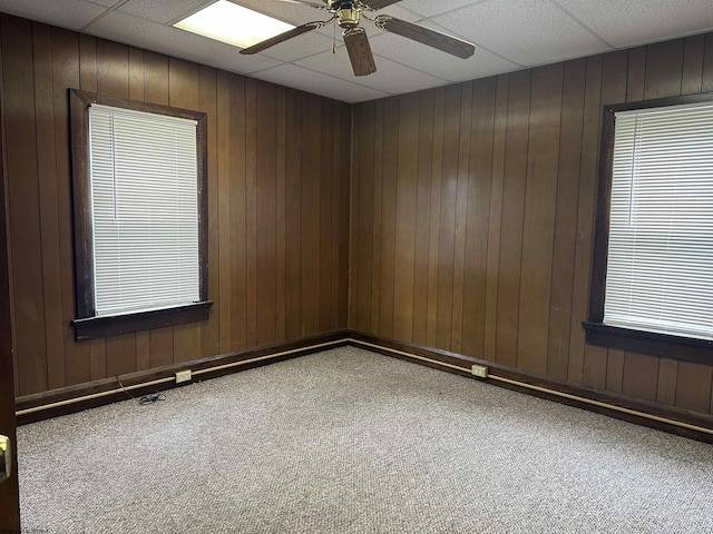 820 Field St, Fairmont, WV 26554 - carpeted spare room featuring a ceiling fan and wood walls