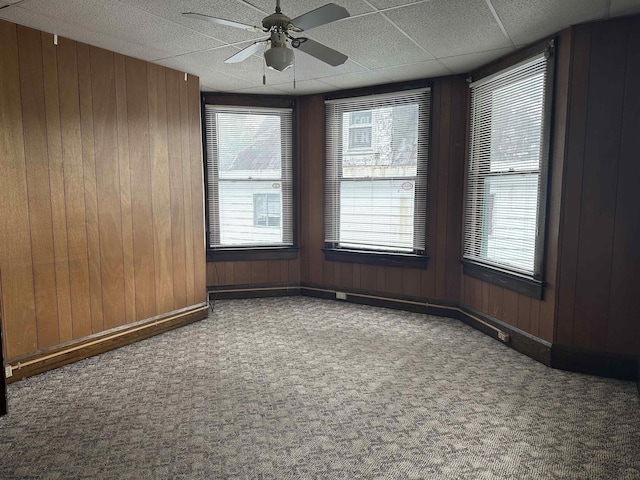 820 Field St, Fairmont, WV 26554 - empty room featuring carpet, a ceiling fan, wooden walls, and baseboards