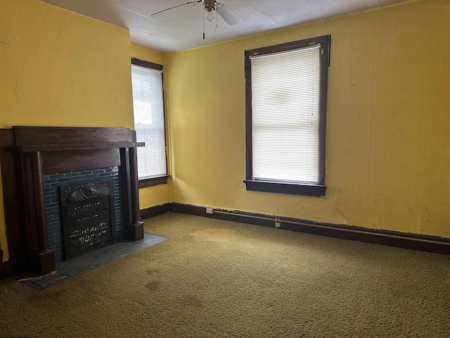820 Field St, Fairmont, WV 26554 - unfurnished living room featuring a ceiling fan, carpet floors, a fireplace with flush hearth, and baseboards