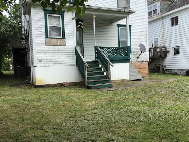 820 Field St, Fairmont, WV 26554 - rear view of house with a lawn and stairs