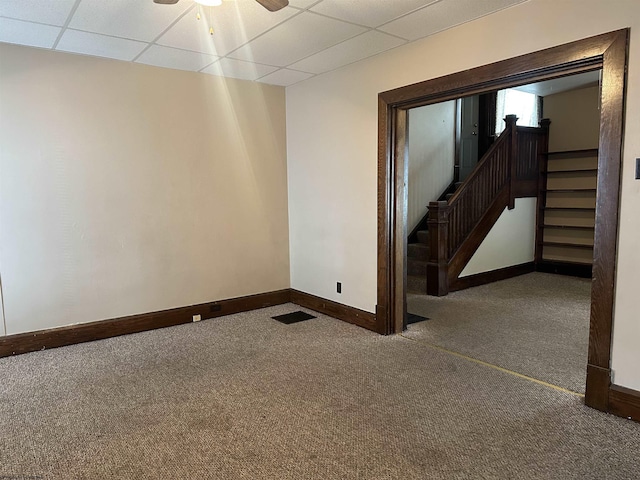 820 Field St, Fairmont, WV 26554 - empty room with carpet flooring, baseboards, stairs, a drop ceiling, and ceiling fan