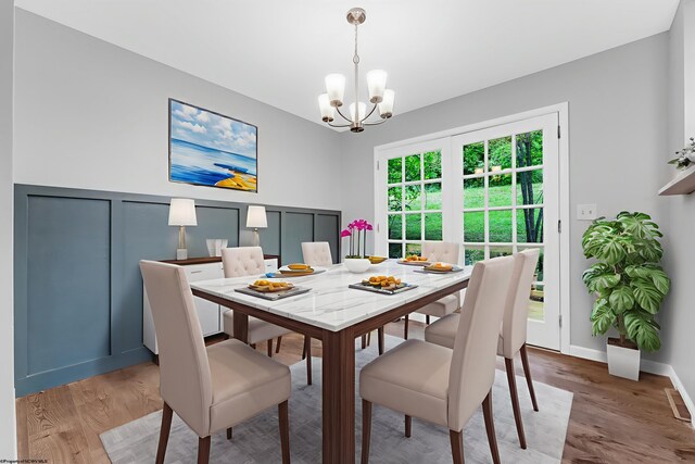135 Celtic Dr, Clarksburg, WV 26301 - dining space with a chandelier and light wood-style flooring
