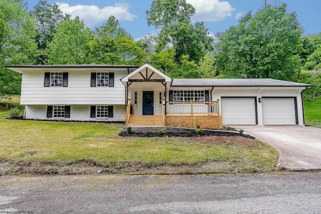 135 Celtic Dr, Clarksburg, WV 26301 - split level home featuring a garage, a front lawn, concrete driveway, a porch, and brick siding