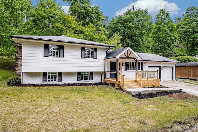 135 Celtic Dr, Clarksburg, WV 26301 - split level home with an attached garage, a front lawn, driveway, and brick siding