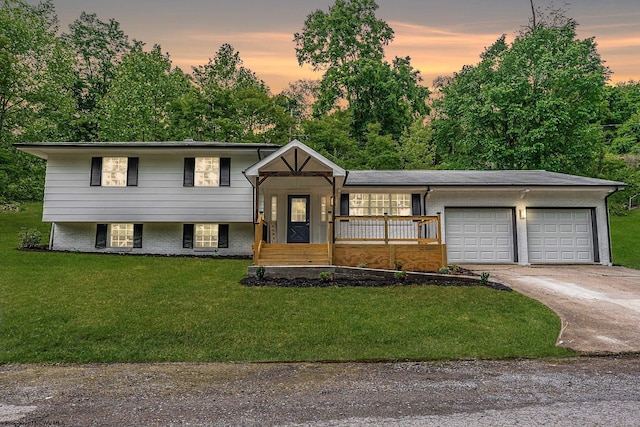 135 Celtic Dr, Clarksburg, WV 26301 - tri-level home with a garage, driveway, a yard, and covered porch