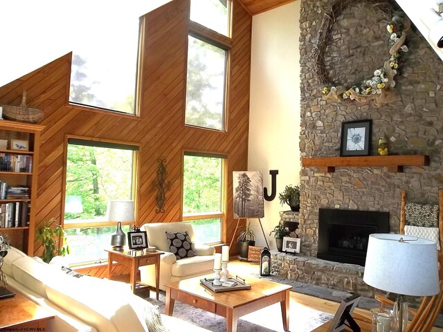 444 Gordon Rd, Beverly, WV 26253 - living room with a towering ceiling, a stone fireplace, and wooden walls