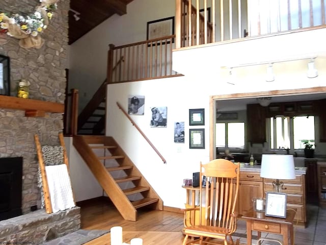 444 Gordon Rd, Beverly, WV 26253 - staircase with a fireplace, wood finished floors, baseboards, and lofted ceiling