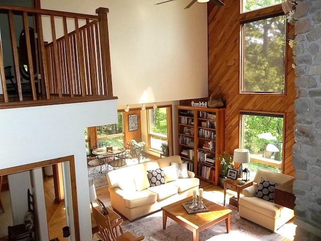 444 Gordon Rd, Beverly, WV 26253 - living area with a towering ceiling, ceiling fan, and wooden walls