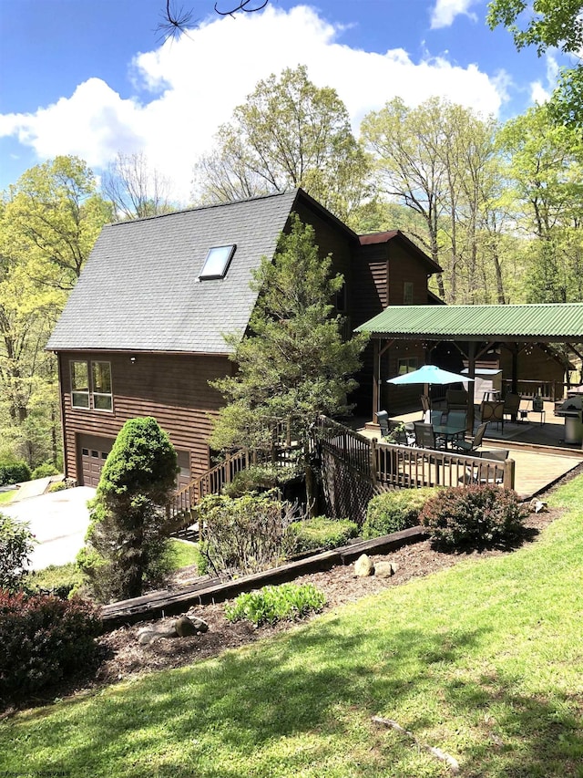 444 Gordon Rd, Beverly, WV 26253 - view of side of home with an attached garage, a lawn, a shingled roof, and concrete driveway