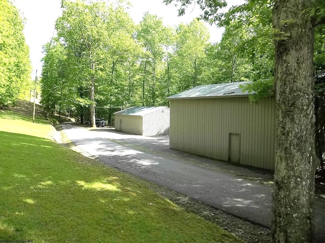 444 Gordon Rd, Beverly, WV 26253 - view of side of home with an outbuilding, metal roof, and a lawn
