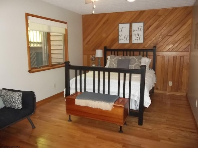 444 Gordon Rd, Beverly, WV 26253 - bedroom with baseboards, wood finished floors, and wood walls
