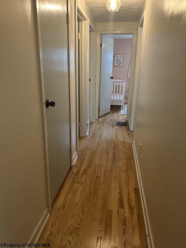 14 Myrna St, Buckhannon, WV 26201 - corridor featuring wood finished floors and baseboards