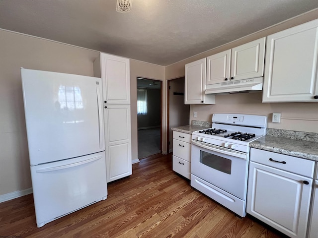 600 Wilson St, Elkins, WV 26241 - kitchen with white appliances, under cabinet range hood, white cabinetry, and dark wood-type flooring