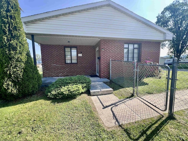 600 Wilson St, Elkins, WV 26241 - bungalow-style home featuring brick siding and a gate