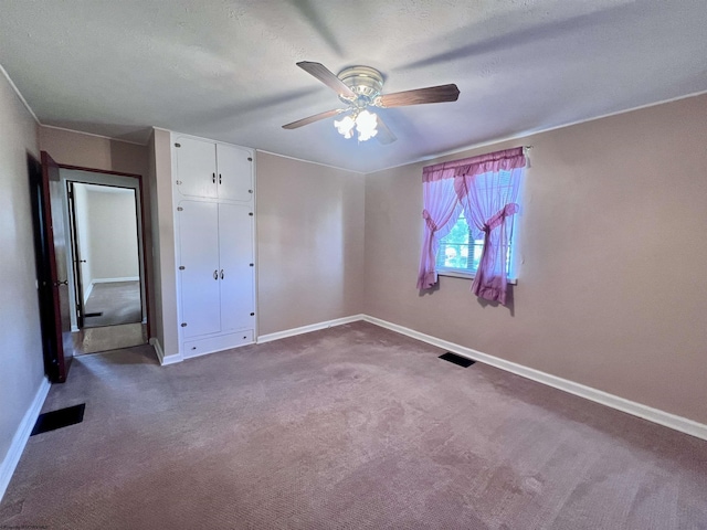 600 Wilson St, Elkins, WV 26241 - unfurnished bedroom with baseboards, carpet, a ceiling fan, and a closet
