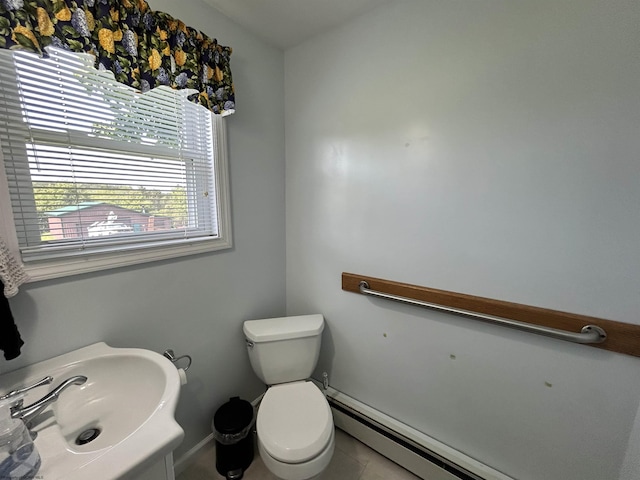 420 Fairfax Ave, Davis, WV 26260 - half bath featuring toilet, tile patterned flooring, a sink, baseboards, and a baseboard radiator