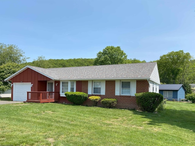 206 Evergreen Dr, Elkins, WV 26241 - ranch-style house with brick siding, a garage, a front yard, driveway, and a shingled roof