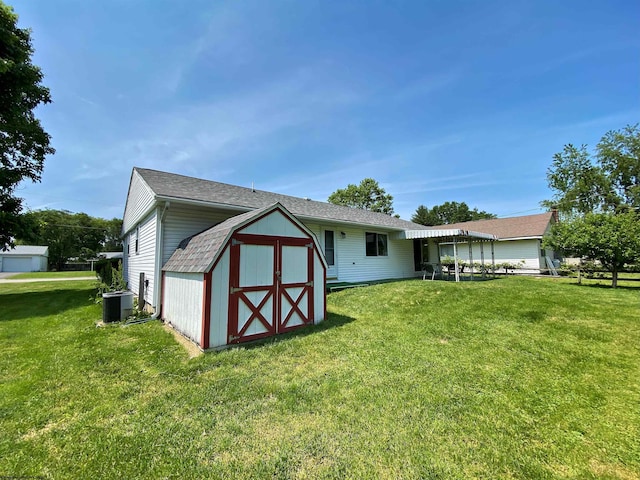 206 Evergreen Dr, Elkins, WV 26241 - rear view of house featuring a lawn and central AC