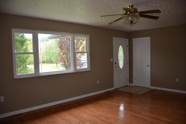 84 Chapman Ln, Weston, WV 26452 - foyer featuring baseboards, light wood-type flooring, and a ceiling fan