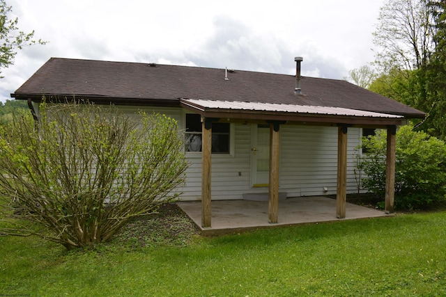 84 Chapman Ln, Weston, WV 26452 - rear view of house with a yard and a patio area
